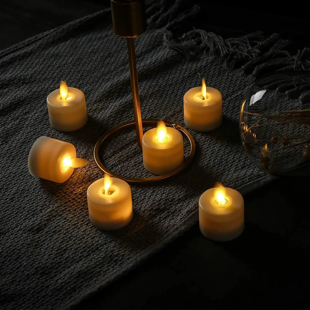 Velas de té LED sin llama de cera auténtica con efecto parpadeante, temporizador con mando y luz ambiental