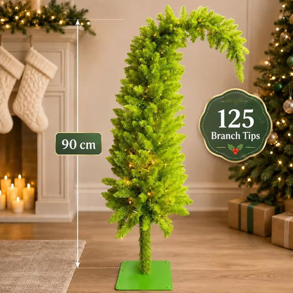 Árbol de Navidad curvado de diseño estilizado y caprichoso con ramas tupidas y soporte de metal