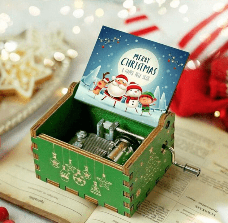 Caja de música navideña de manivela con melodía acogedora y motivo navideño tradicional