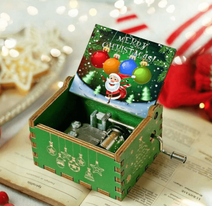 Caja de música navideña de manivela con melodía acogedora y motivo navideño tradicional