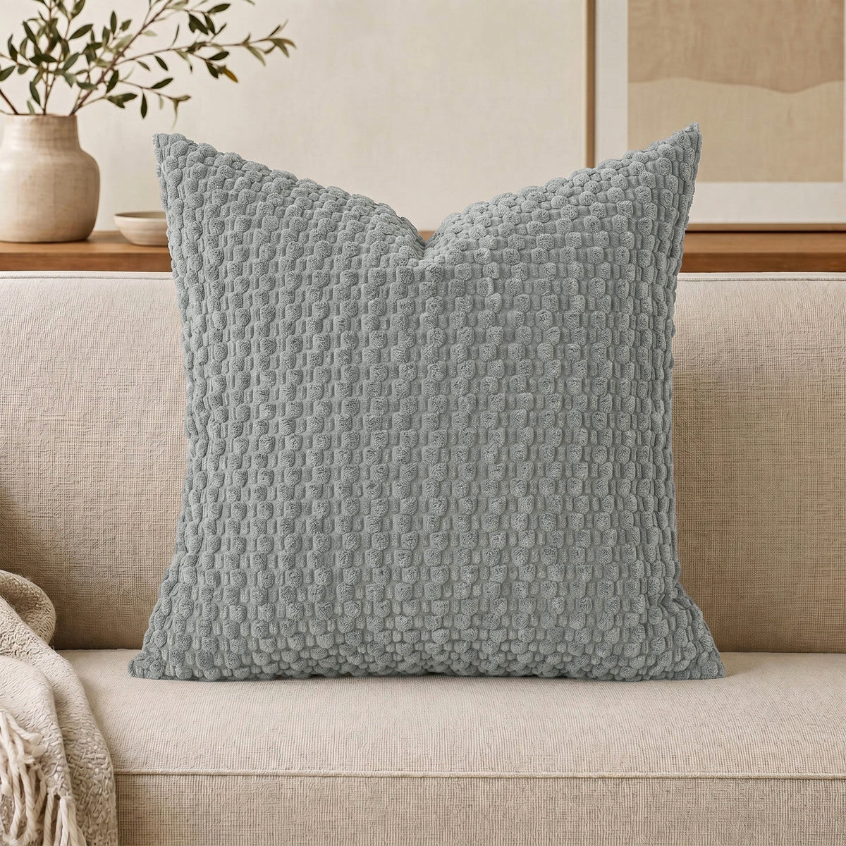 Cojín decorativo de chenilla texturizada con tejido de motas en relieve