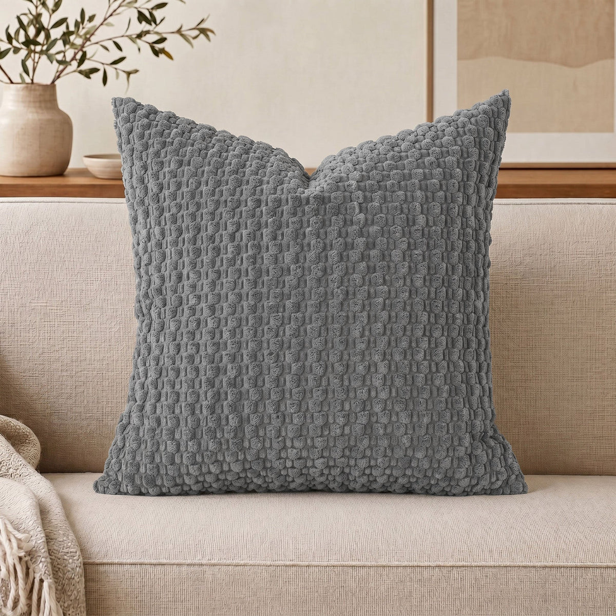 Cojín decorativo de chenilla texturizada con tejido de motas en relieve