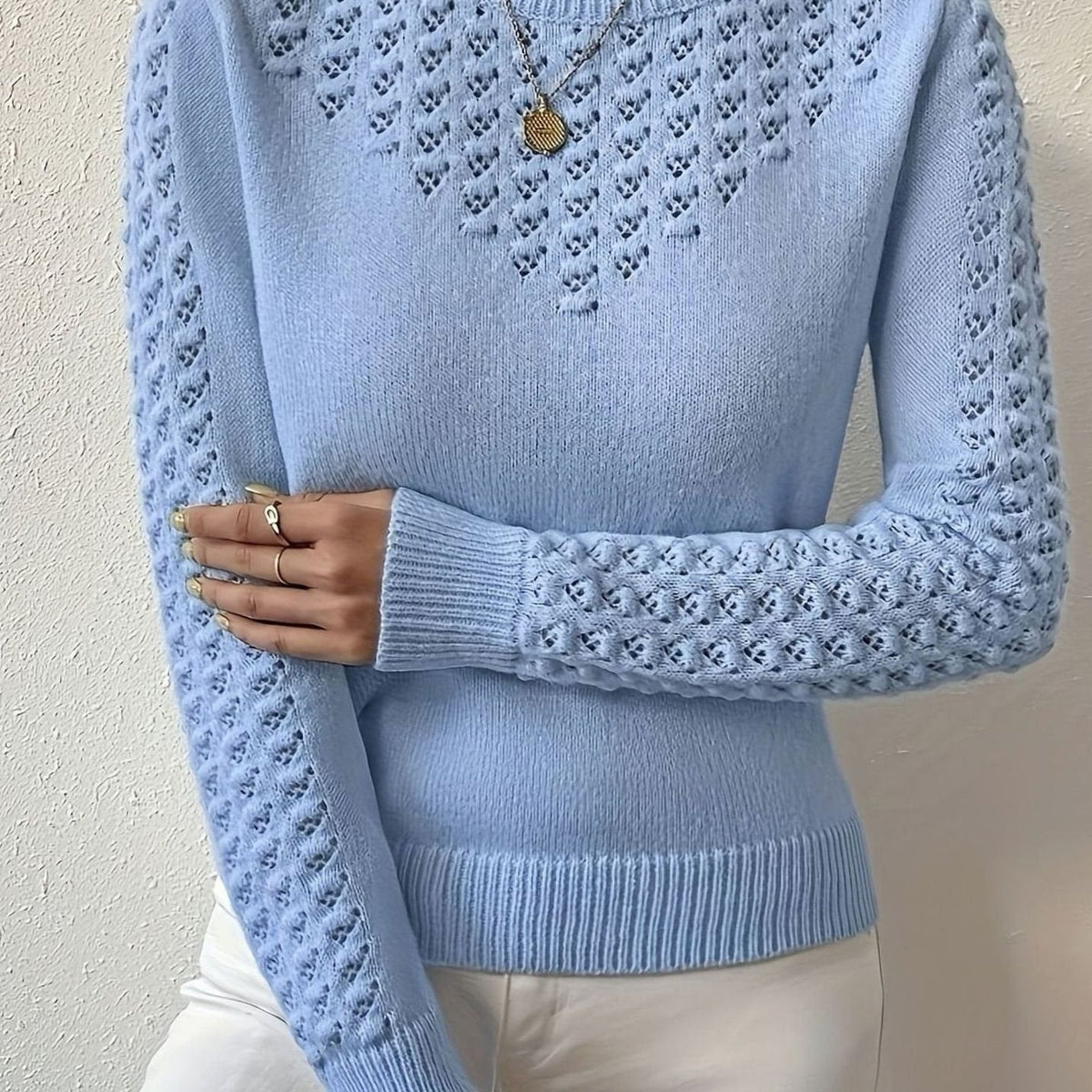 Jersey de punto calado con cuello redondo y manga larga para mujer