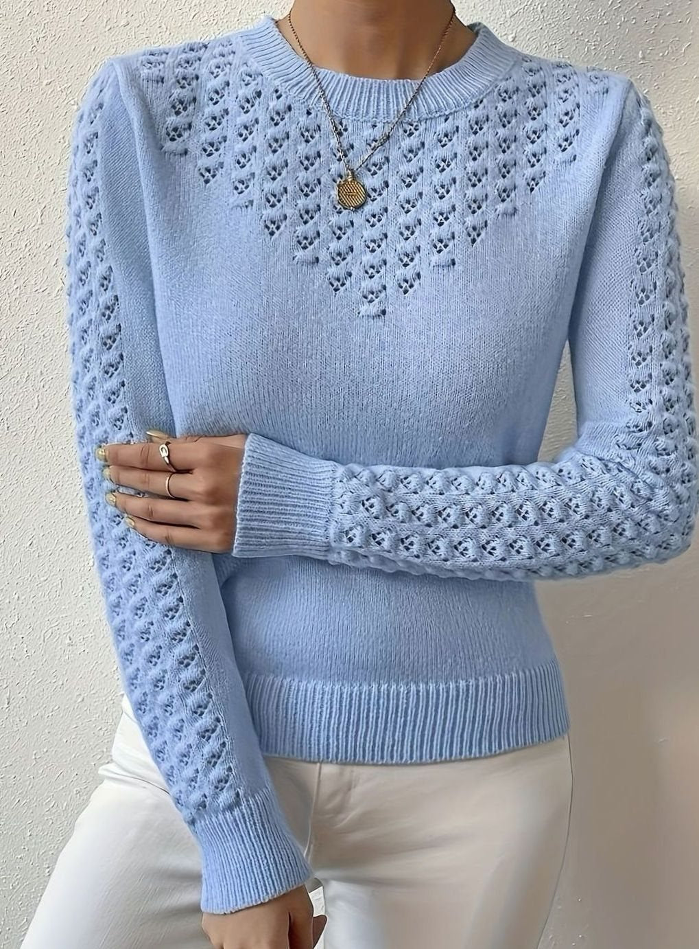 Jersey de punto calado con cuello redondo y manga larga para mujer