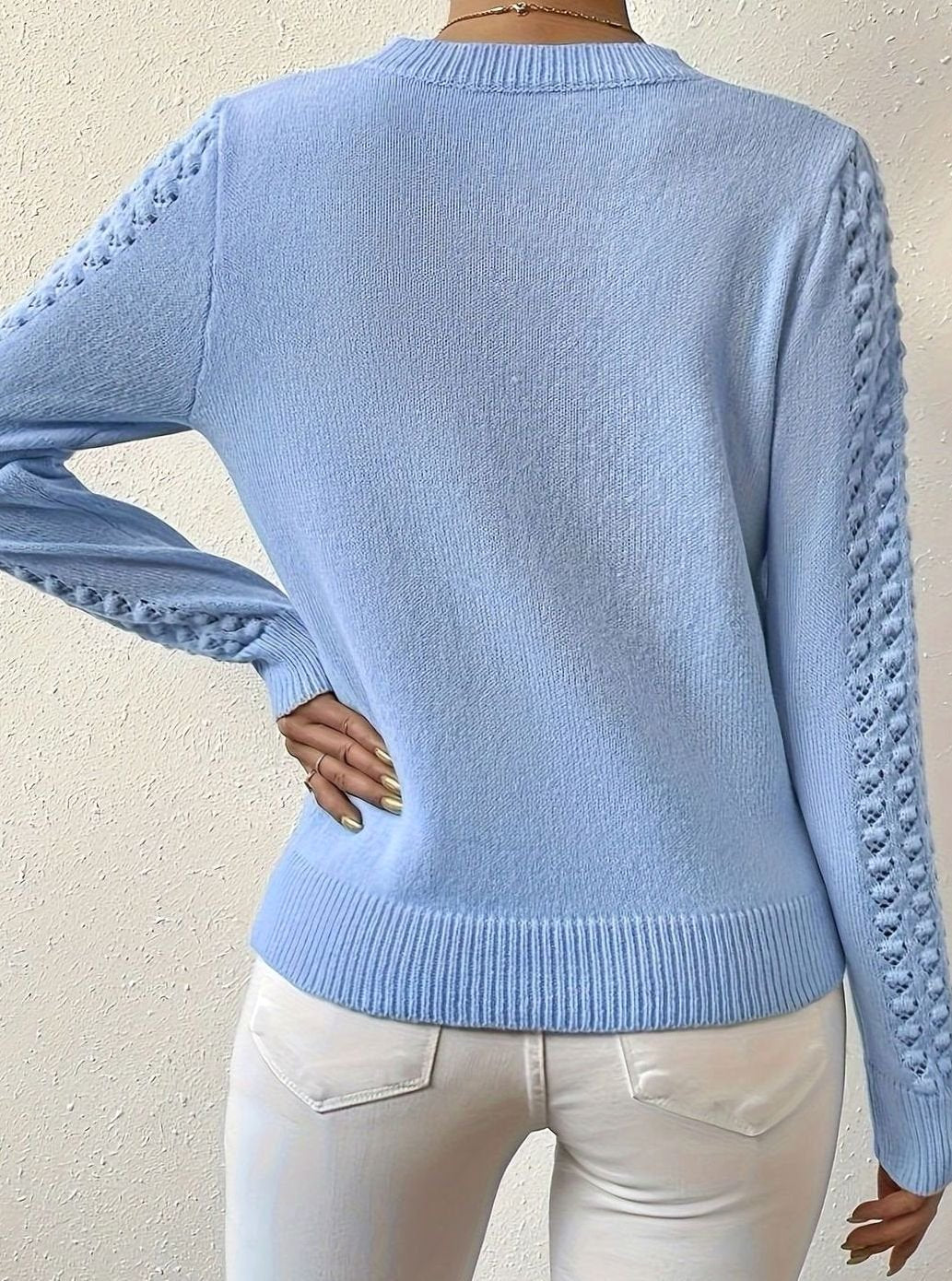 Jersey de punto calado con cuello redondo y manga larga para mujer