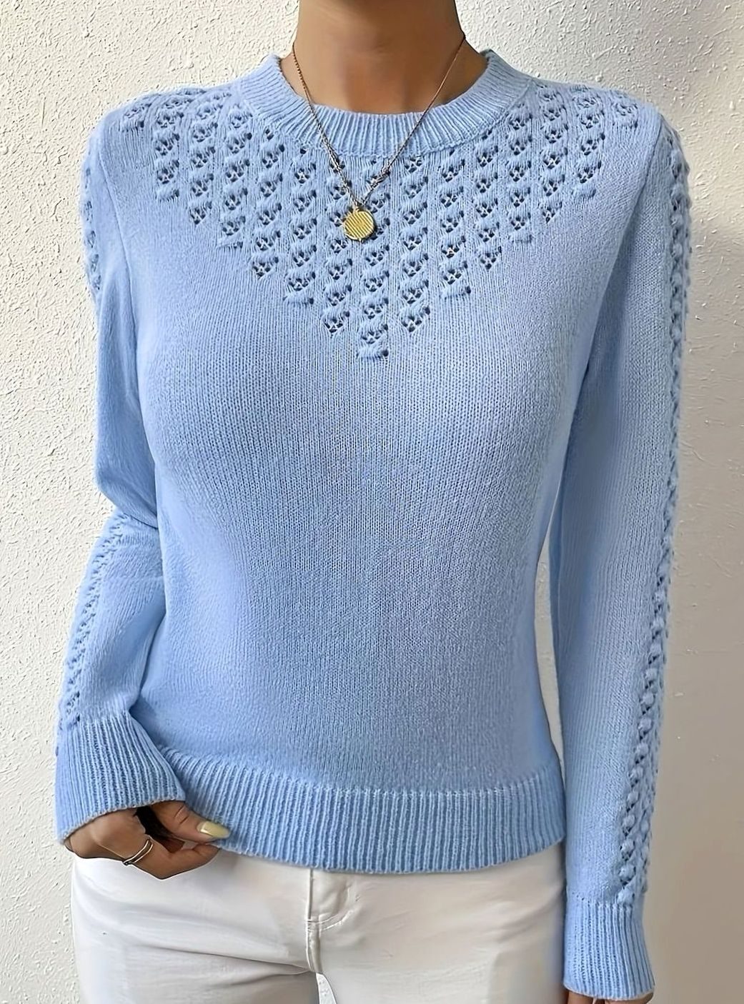 Jersey de punto calado con cuello redondo y manga larga para mujer