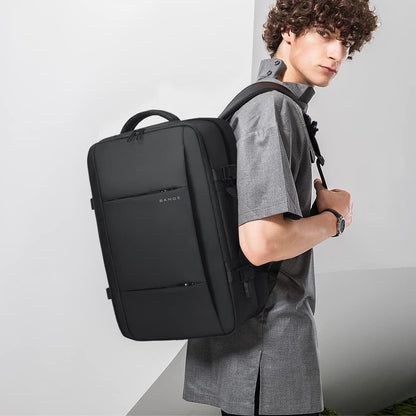 Mochila de viaje impermeable expandible de 26 a 45L con funda para laptop y asa de duffle