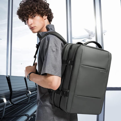 Mochila de viaje impermeable expandible de 26 a 45L con funda para laptop y asa de duffle