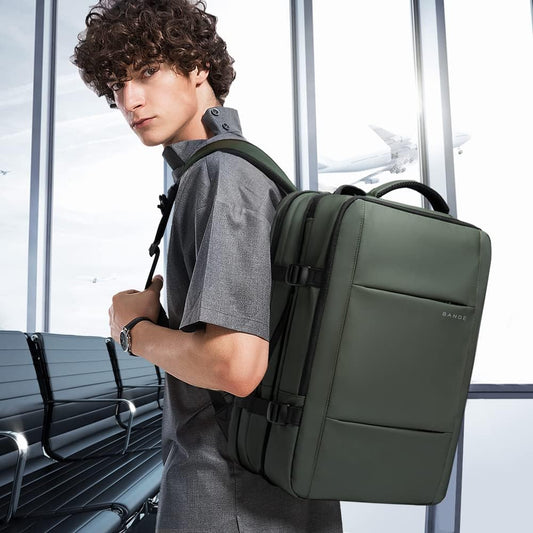 Mochila de viaje impermeable expandible de 26 a 45L con funda para laptop y asa de duffle