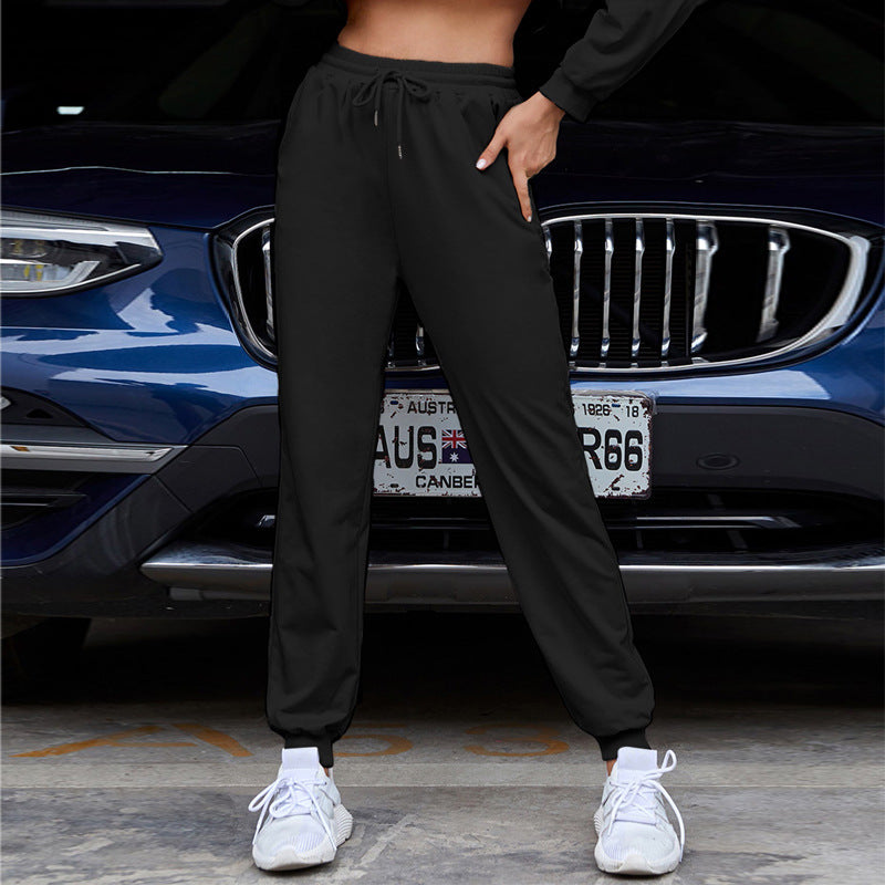 Pantalón jogger de tiro alto y corte holgado para mujer con cintura elástica, cordón ajustable y puños acanalados