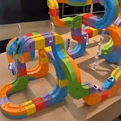 Set de construcción de circuito de tren 3D para niños con locomotora recargable