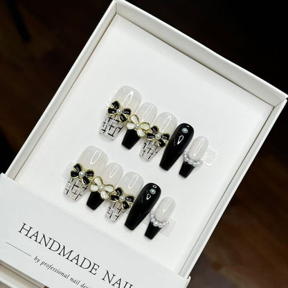 Uñas postizas press-on decorativas hechas a mano largas estilo stiletto con detalles florales y perlas